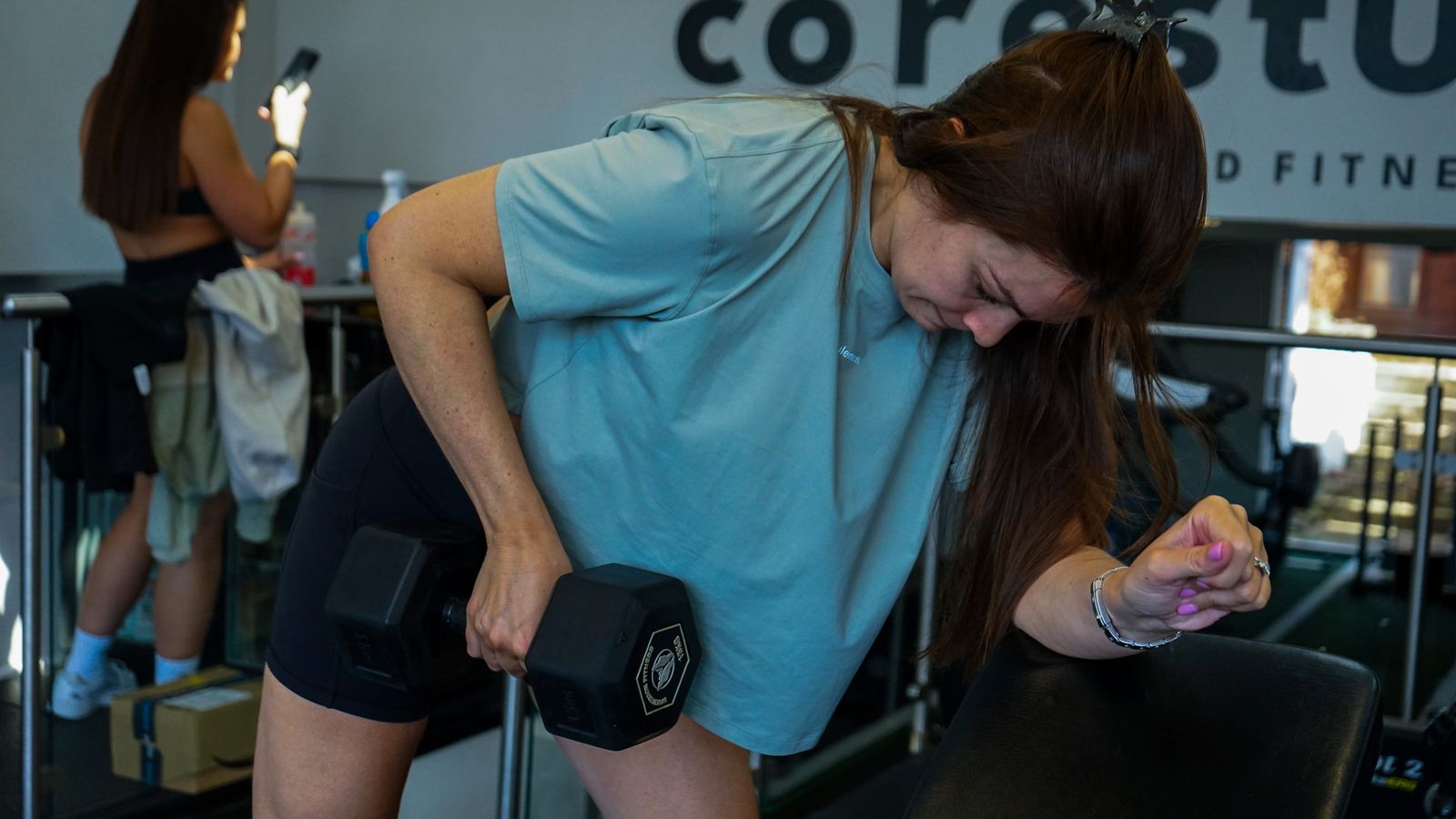 A member doing a supported dumbbell row at Core Studio, Blackheath