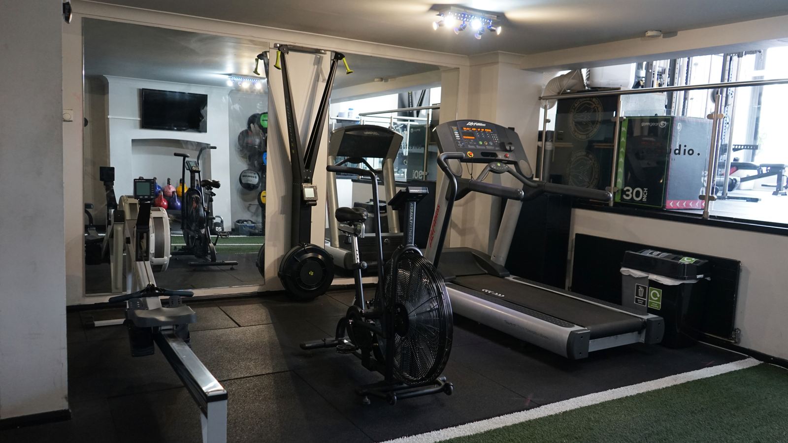 Treadmill, assault bike and rower in the cardio area at Core Studio, Blackheath SE3