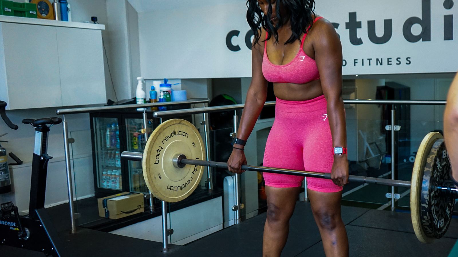 A member deadlifting with her personal trainer alongside her at Core Studio, Blackheath
